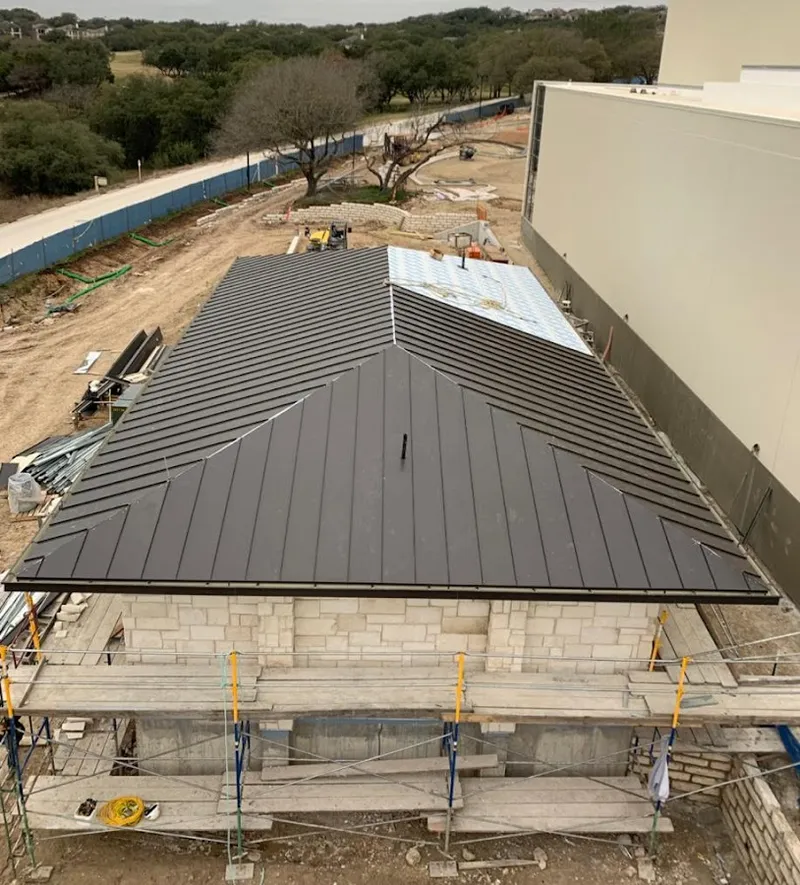 Metal roof new construction with scaffolding in Americus